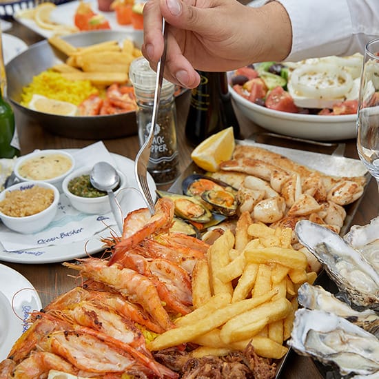 Ocean Basket platter for two with other meals on display slider banner